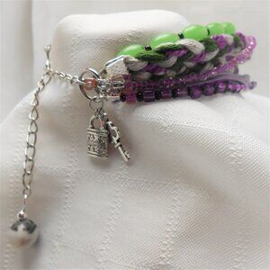 Handmade bracelet with rows of threads, beads, and charms No. 220